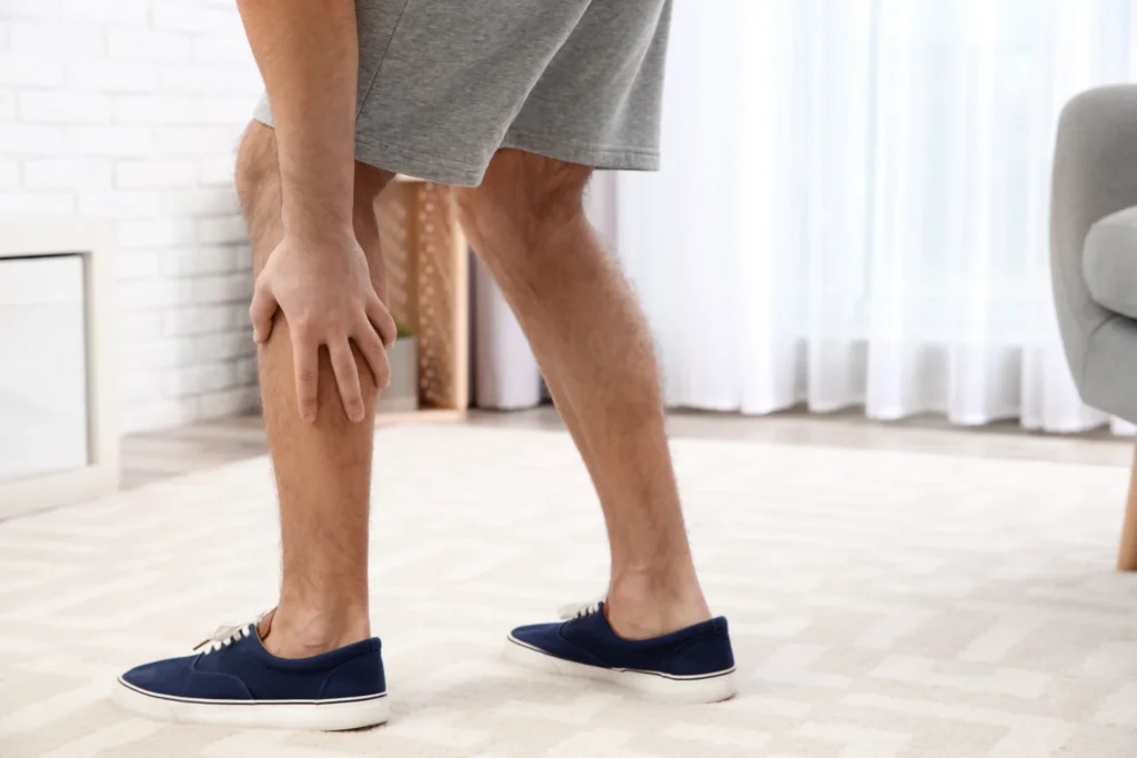 adult man with calf muscle pain at home 2026 03 08 23 06 05 utc