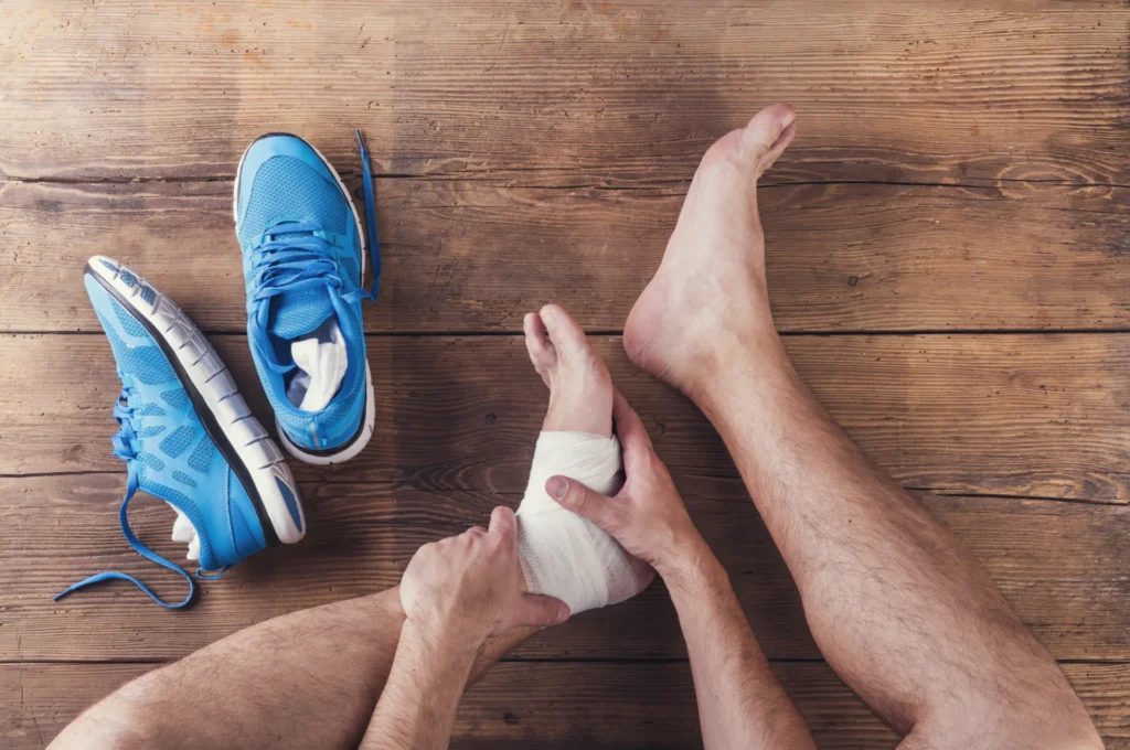 ankle injury treatment with shoe on wooden surface 2026 03 10 04 02 19 utc