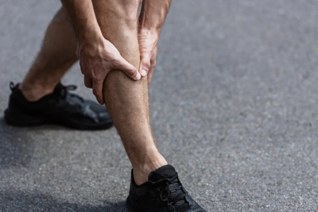 partial view of sportsman in black sneakers with l 2026 03 11 04 16 11 utc