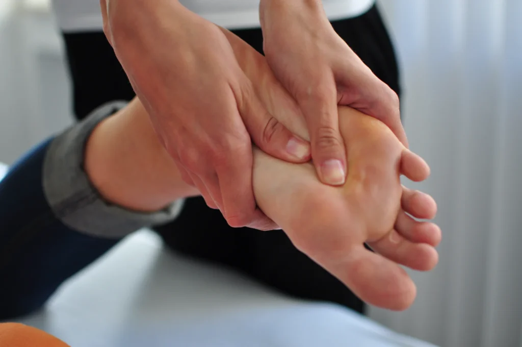 receiving a foot massage indoors on a table 2026 01 06 09 19 03 utc